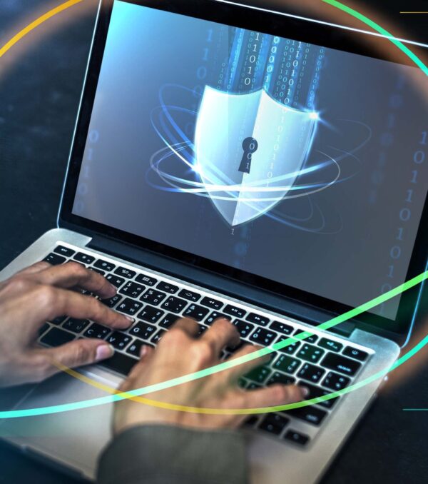 Hacker cracking the security code on a laptop